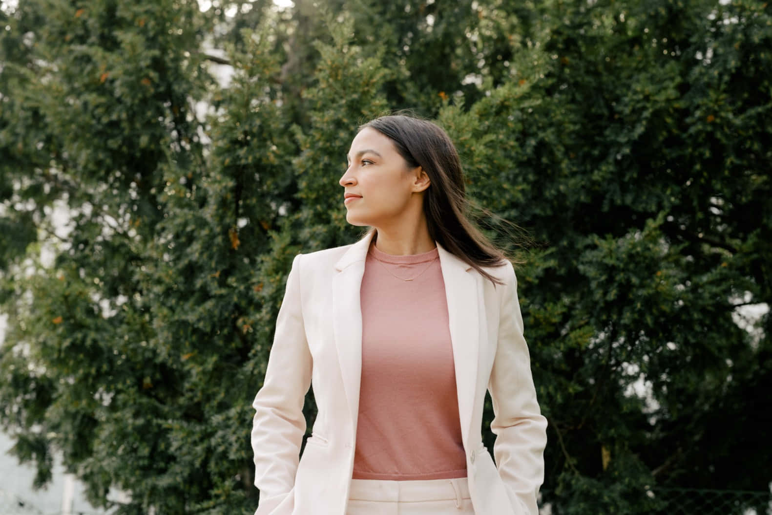 Alexandria Ocasio-cortez Beneath A Tree Background