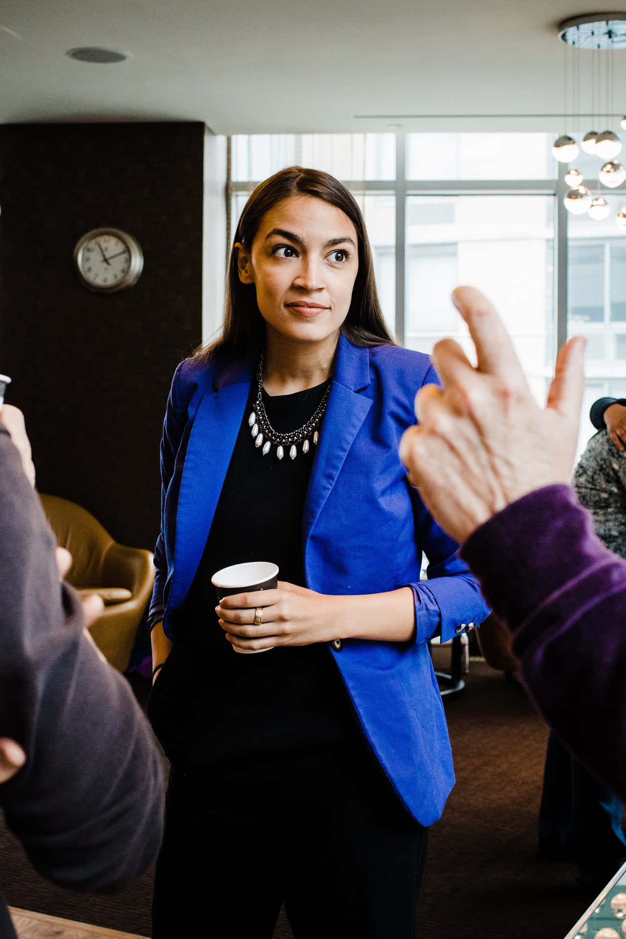 Alexandria Ocasio-cortez In A Blue Blazer Background