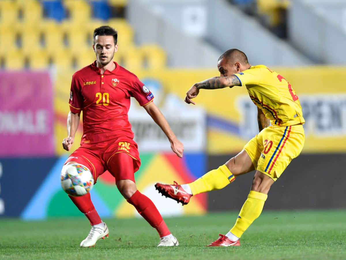 Alexandru Mitrita Kicking The Ball Past Mirko Ivanic Background