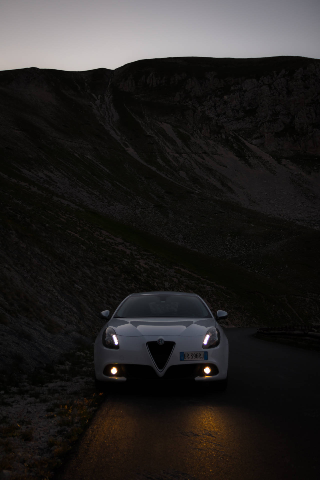 Alfa Romeo Giulietta Illuminated At Night Background