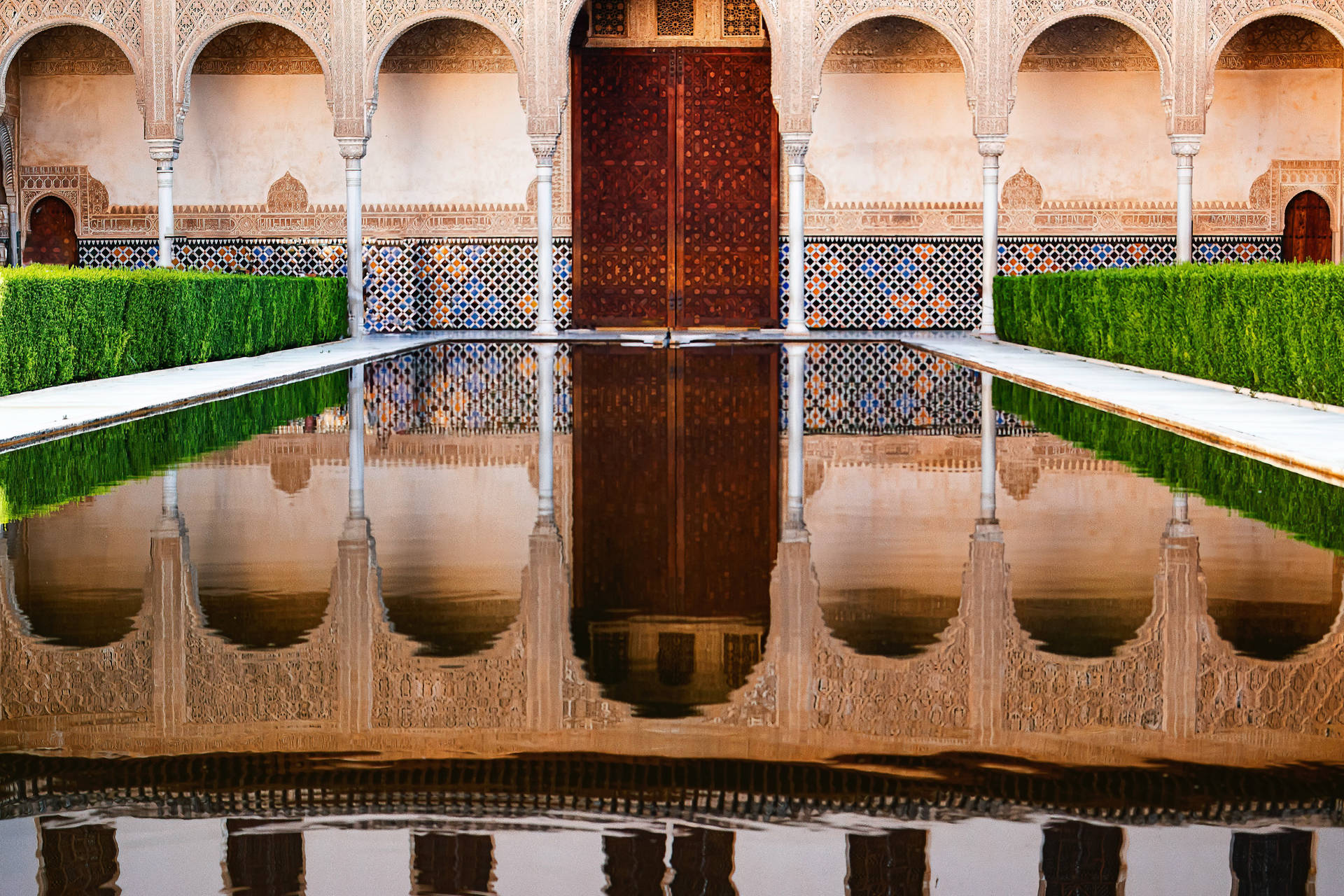 Alhambra Pool Reflects Arches Background