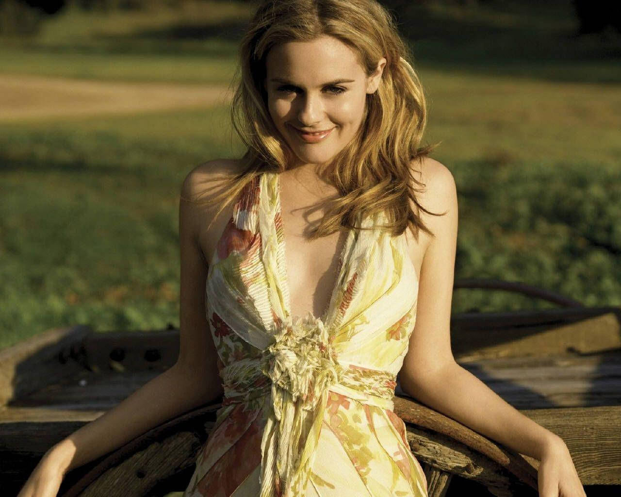 Alicia Silverstone Sporting A Halter Dress Background