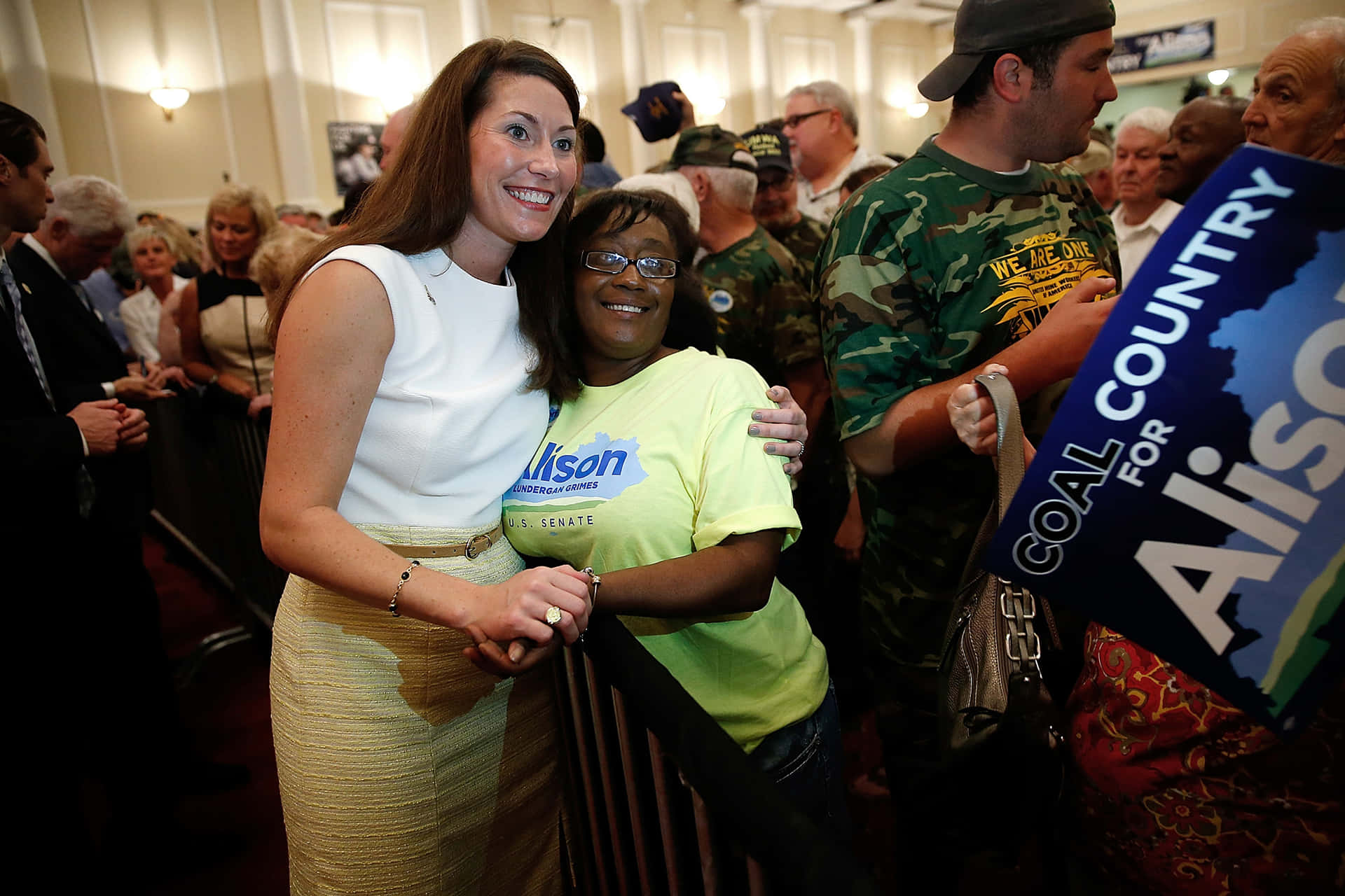 Alison Lundergan Grimes Hugging Woman Background