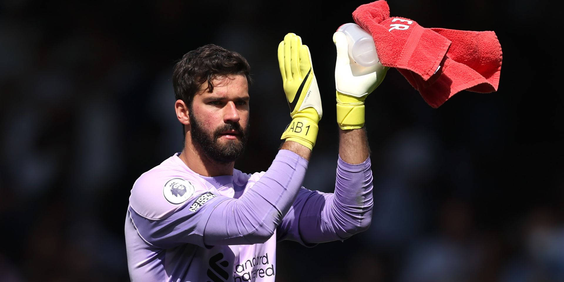 Alisson Becker Holding Bottle And Towel Background