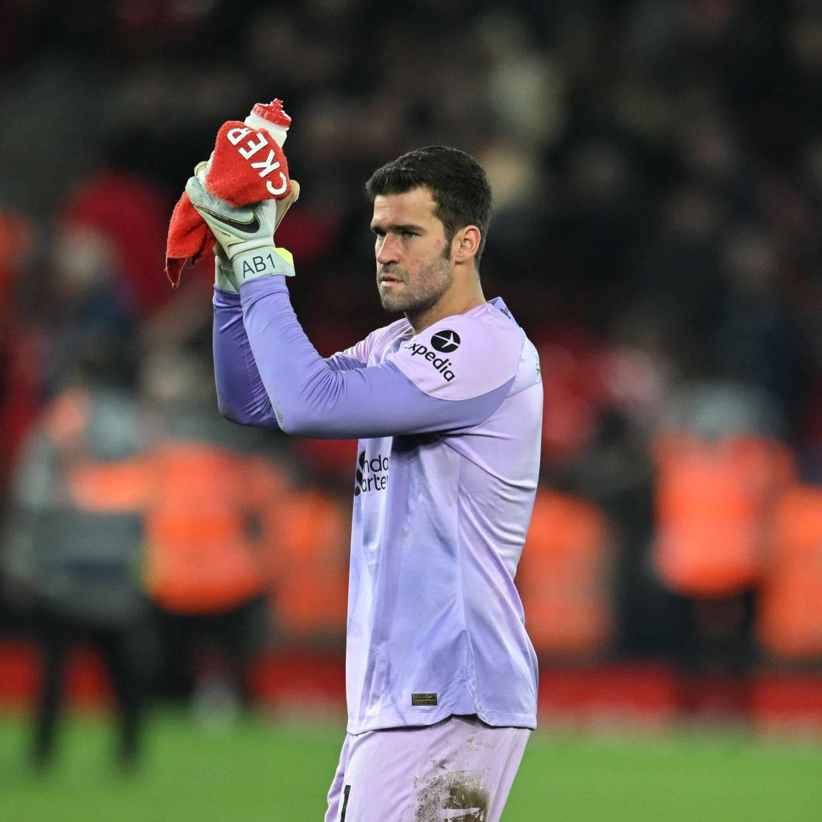 Alisson Becker Holding Bottle Up Background