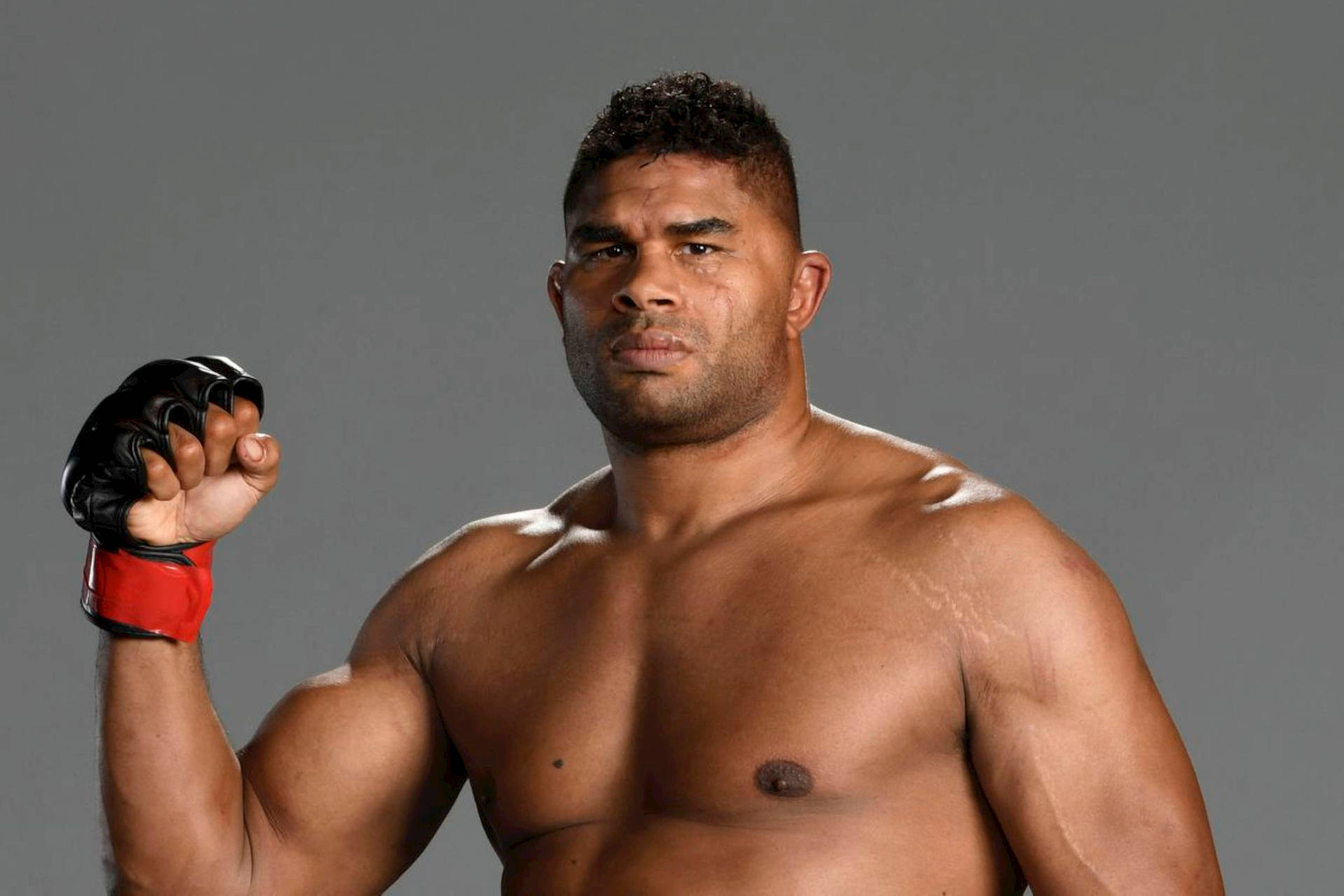 Alistair Overeem Flexing Right Arm Background