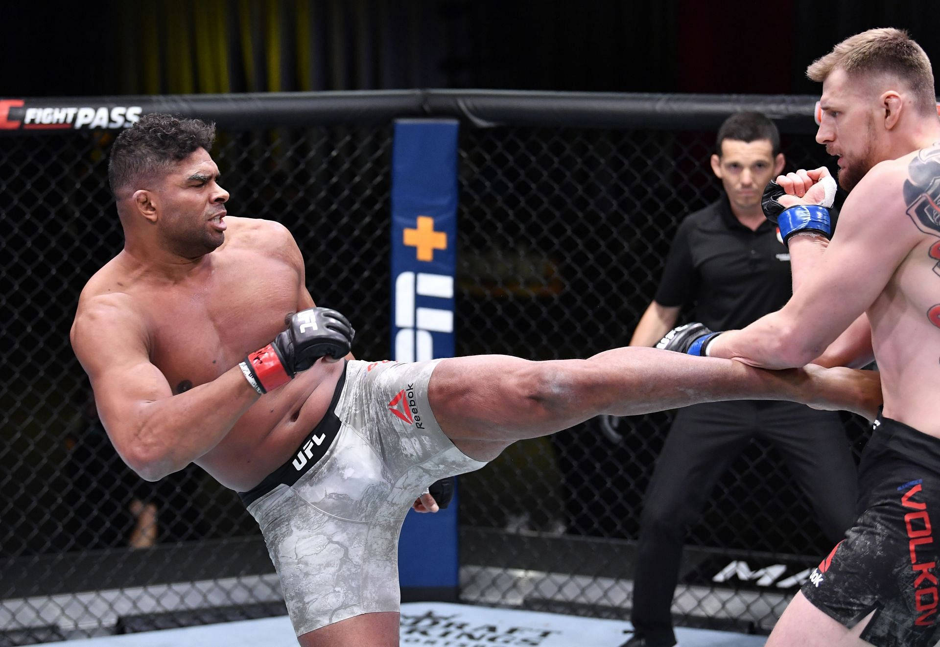 Alistair Overeem Kicking An Opponent Background