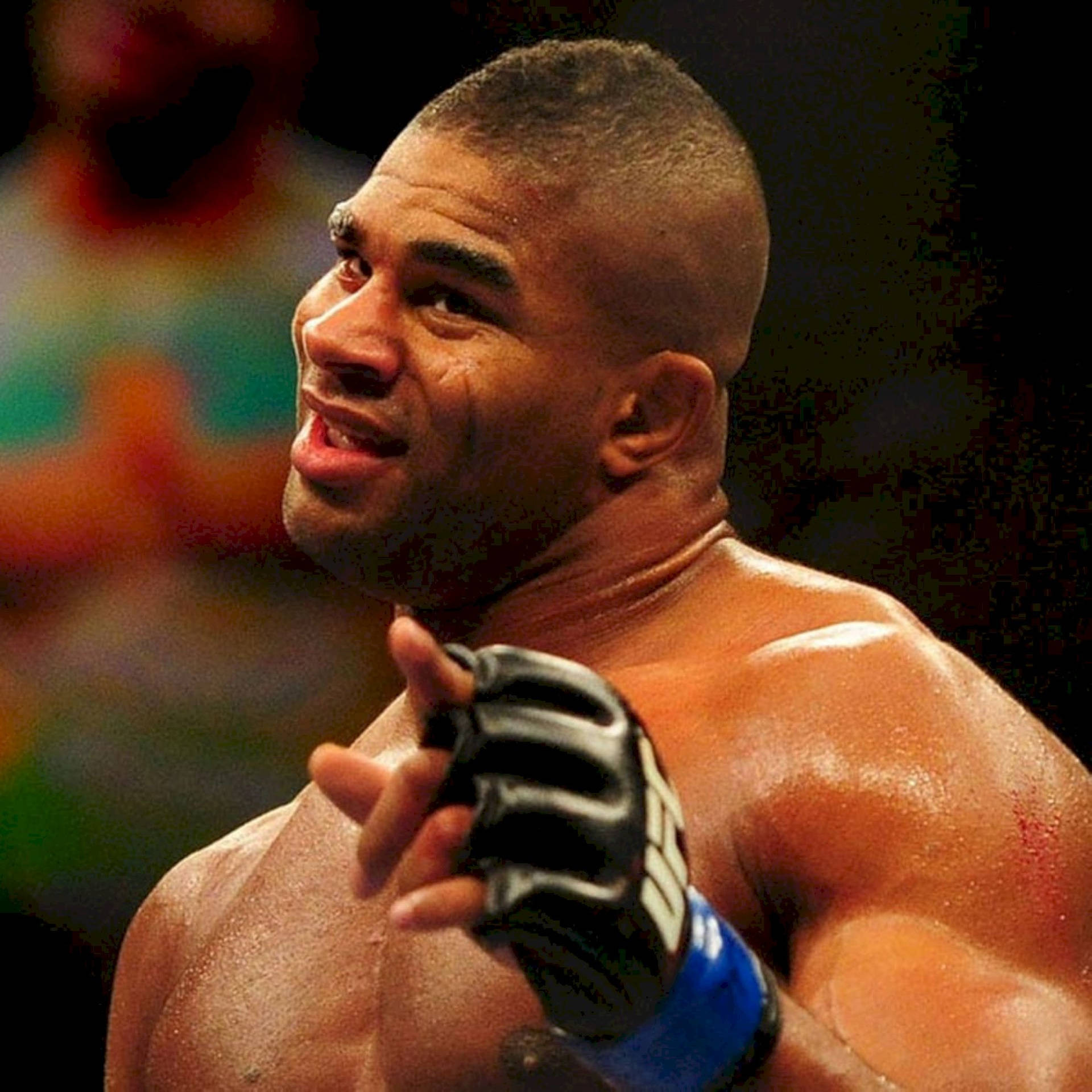 Alistair Overeem Pointing With Gloved Hand Background