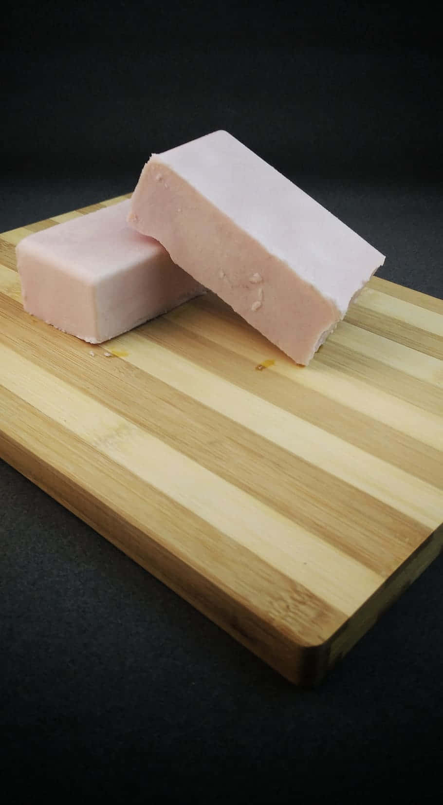 All-natural Soap Bars On A Wooden Chopping Board
