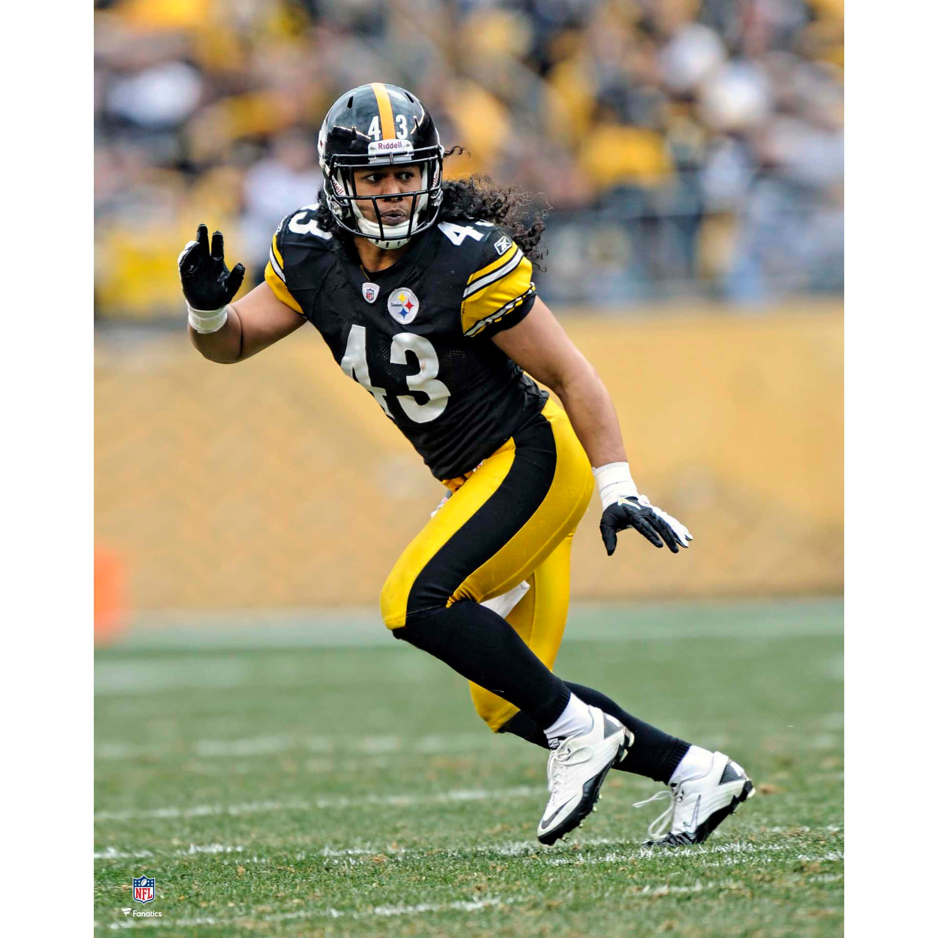 All-pro Pittsburgh Steeler Safety Troy Polamalu In Action Background