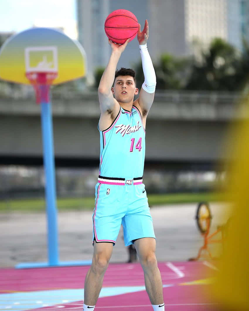 All-star Rookie Tyler Herro Shooting A Three-pointer Background