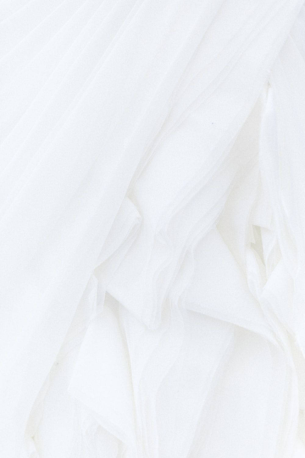 All White Fabric With Uneven Folds Background