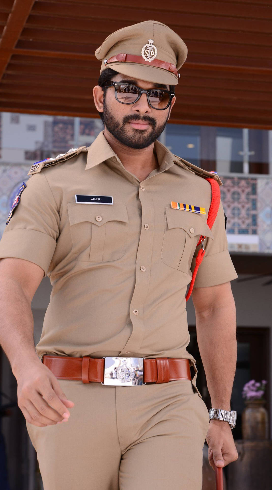Allu Arjun In Brown Police Uniform Background
