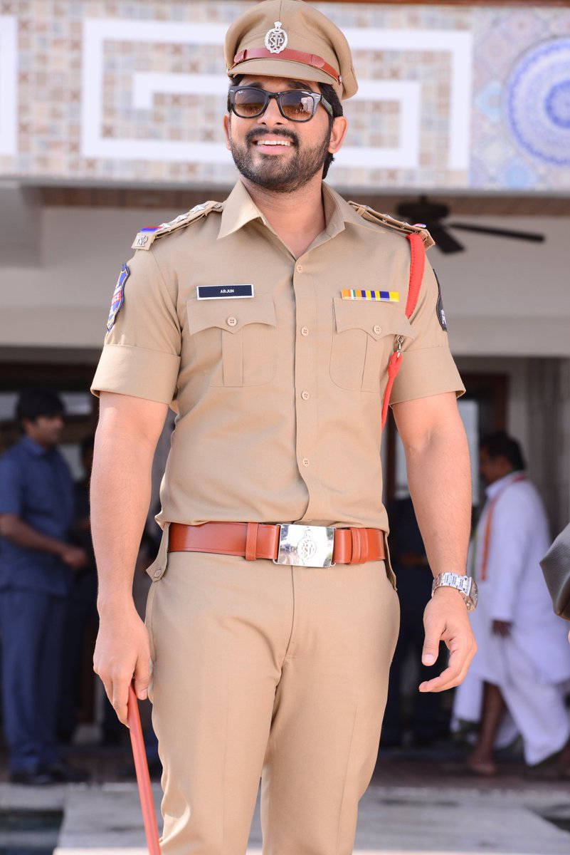 Allu Arjun Smiling In Police Uniform Background