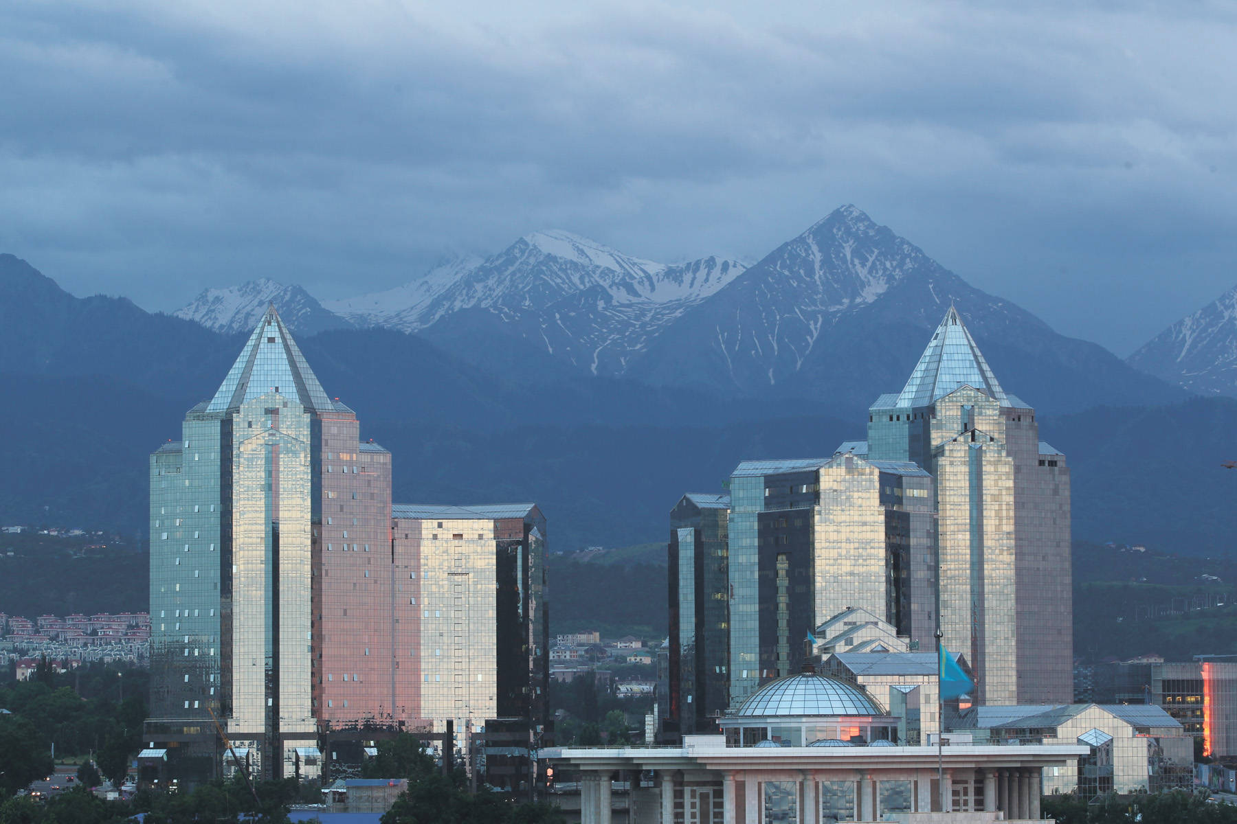 Almaty Buildings Against Mountains Background