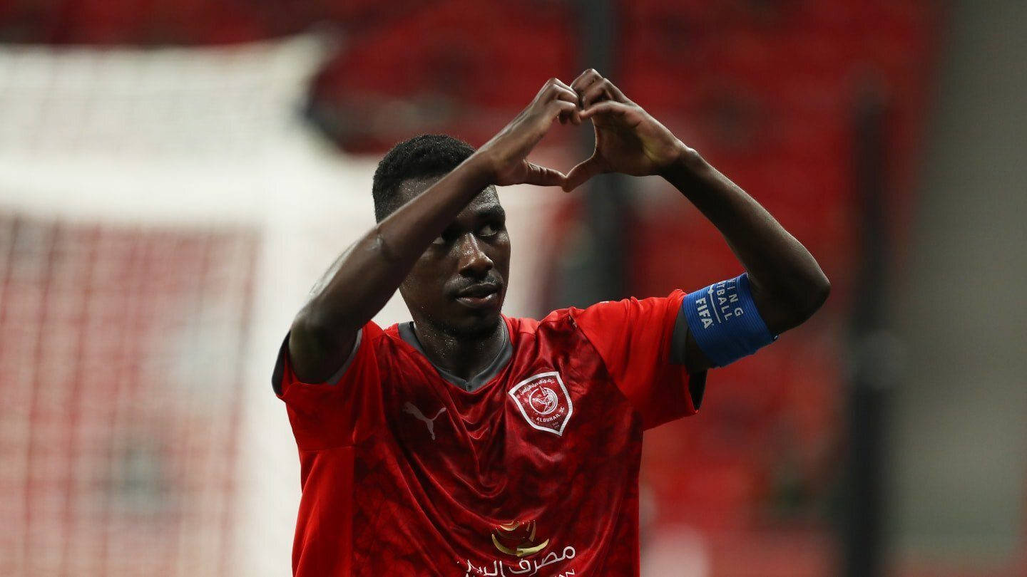 Almoez Ali, Qatar’s Star Striker Gesturing Love Sign In Team Uniform