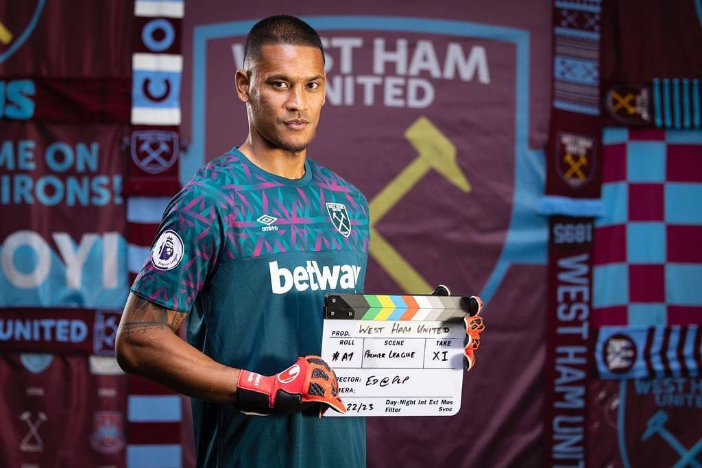 Alphonse Areola Holding A Clapper Board Background