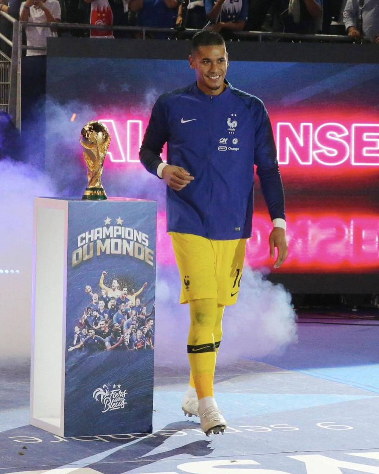 Alphonse Areola Standing Beside Trophy