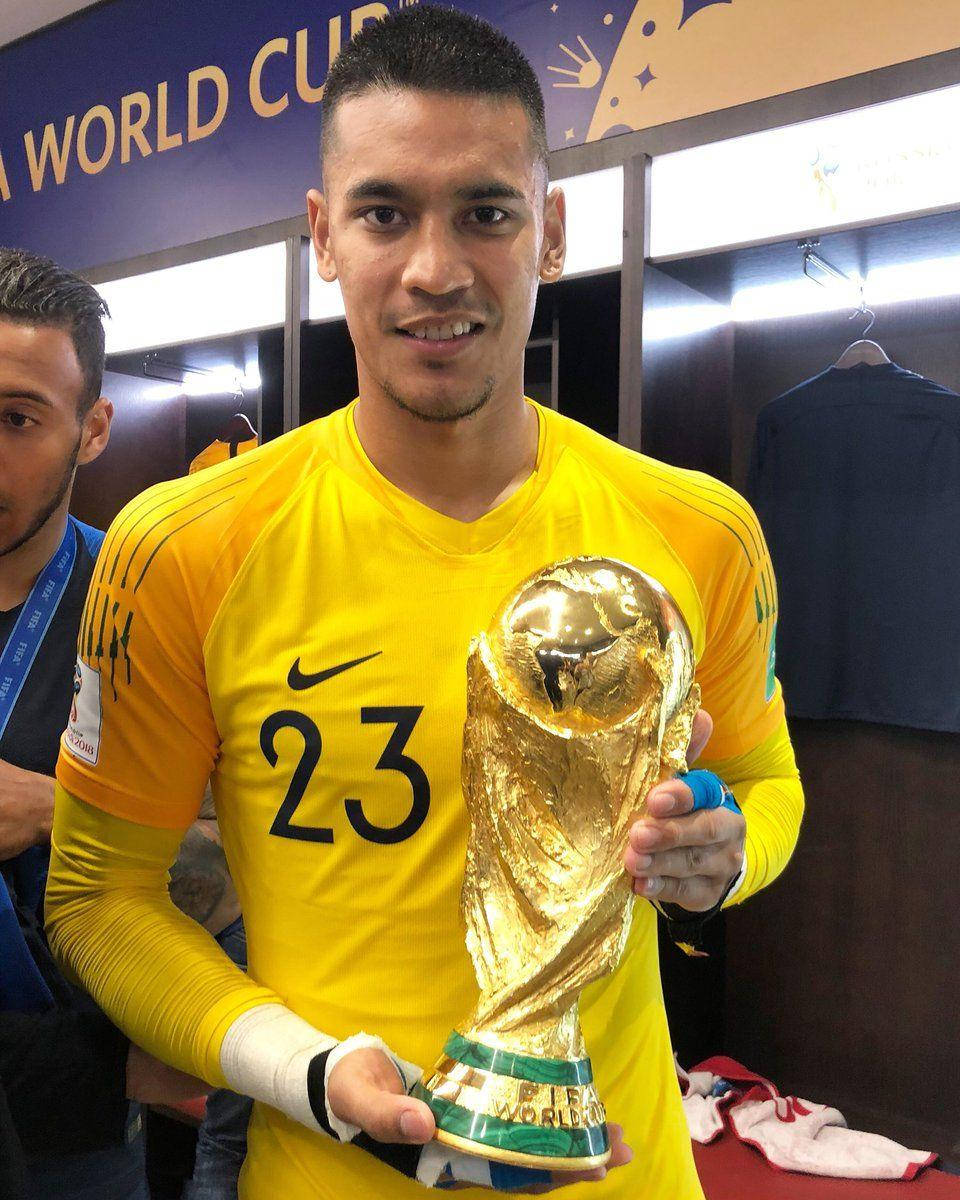 Alphonse Areola Triumphantly Holding A Trophy Background