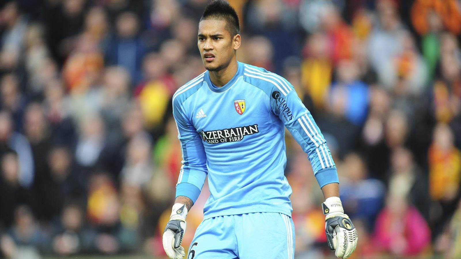 Alphonse Areola Wearing Blue Uniform Background