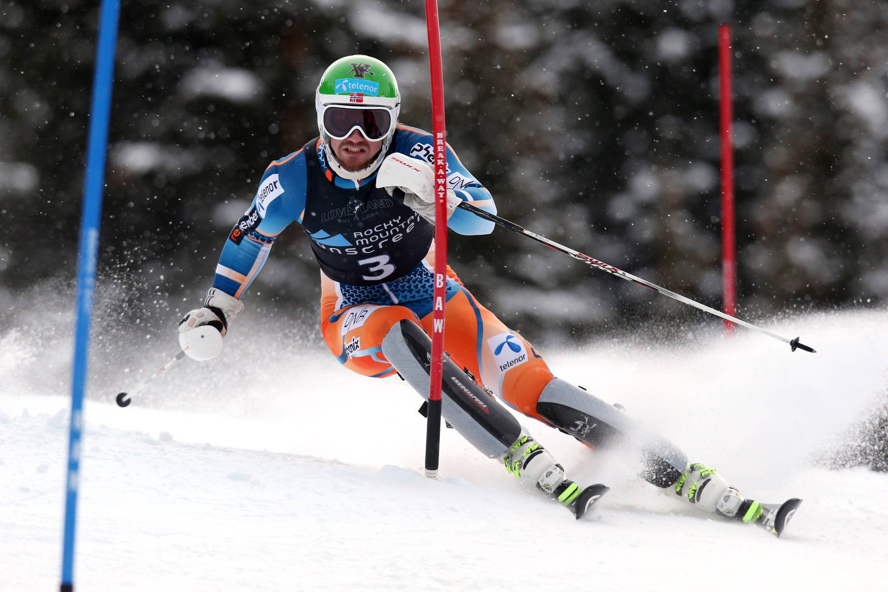 Alpine Racer In Blue Suit Background