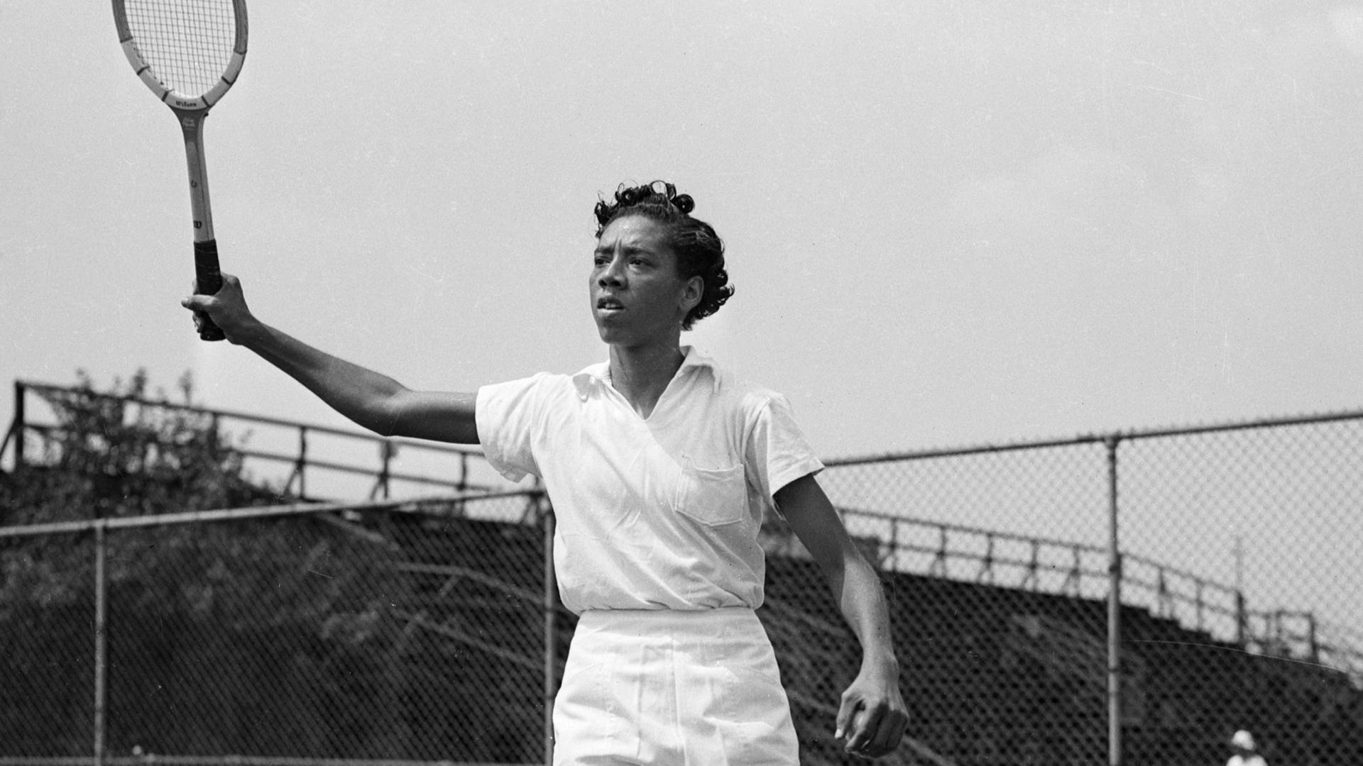 Althea Gibson Swinging In Major Tennis Championships Background