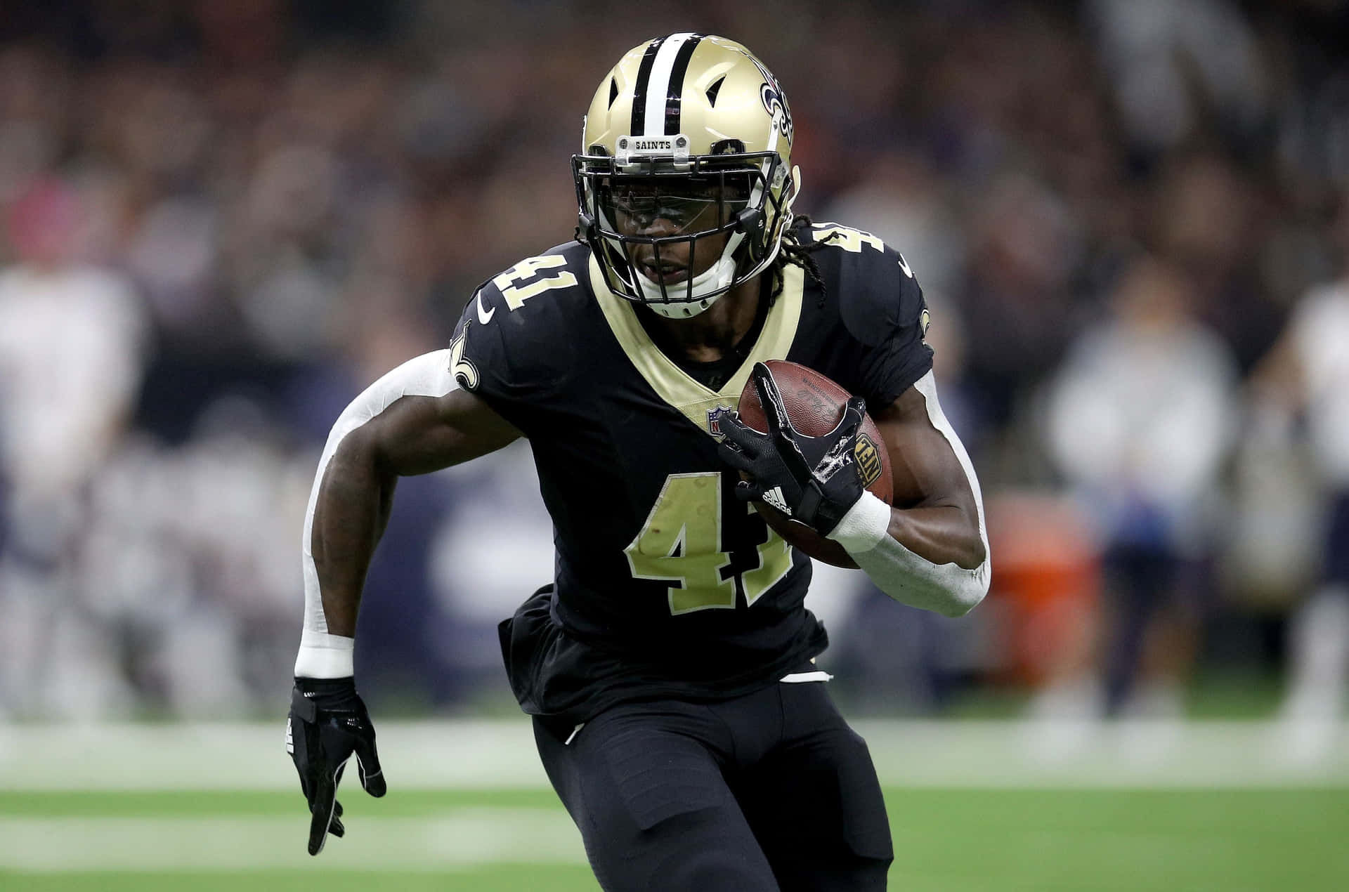 Alvin Kamara Of The New Orleans Saints Dives For A Touchdown Background
