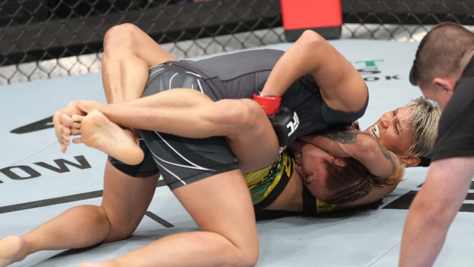 Amanda Lemos In Action During A Ufc Bout Background