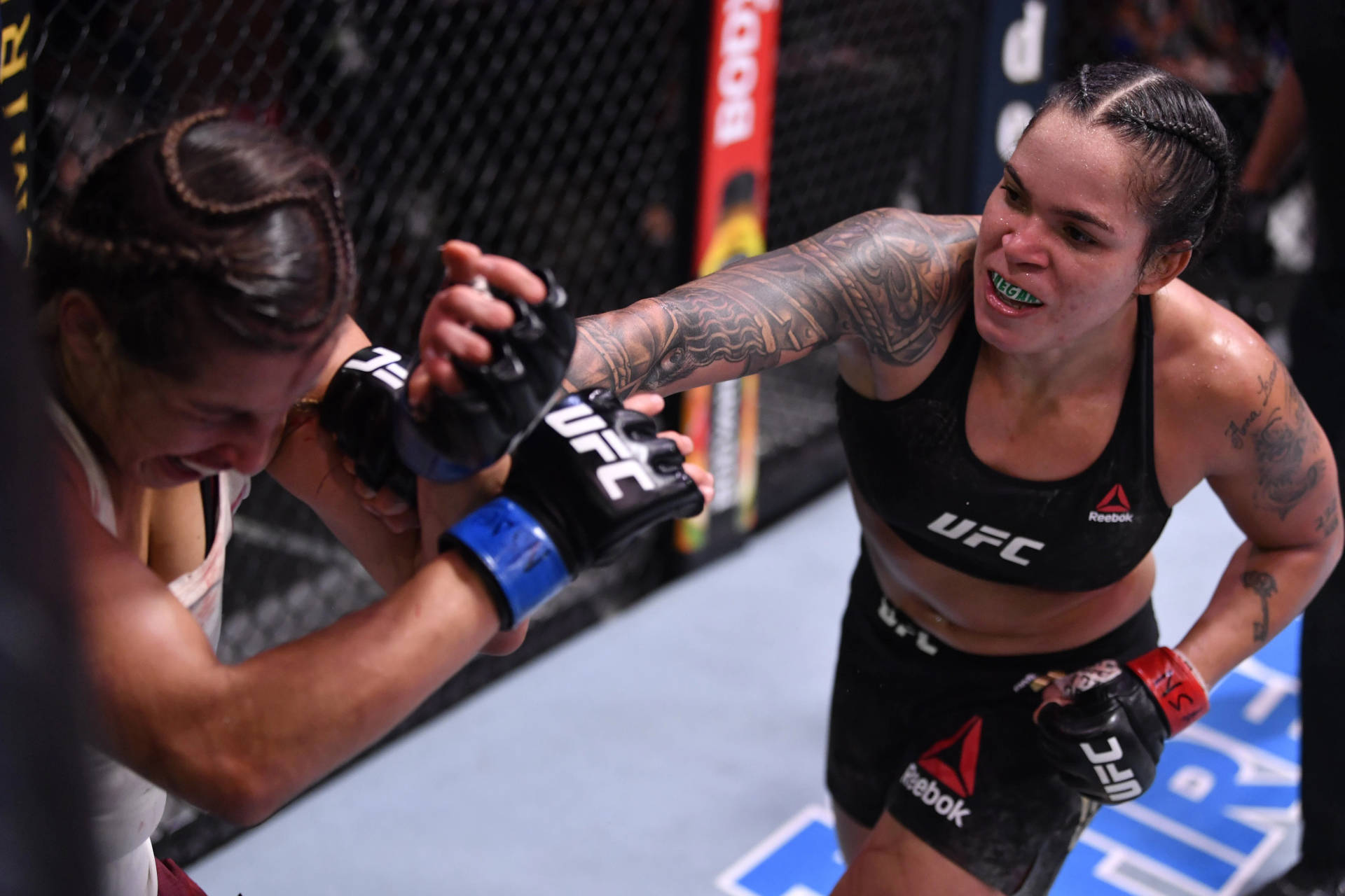 Amanda Nunes Face Punch Background