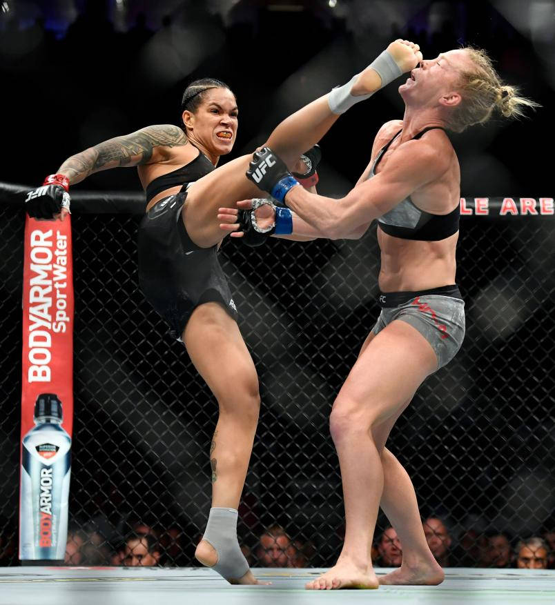 Amanda Nunes Kicks Holly Holm Background