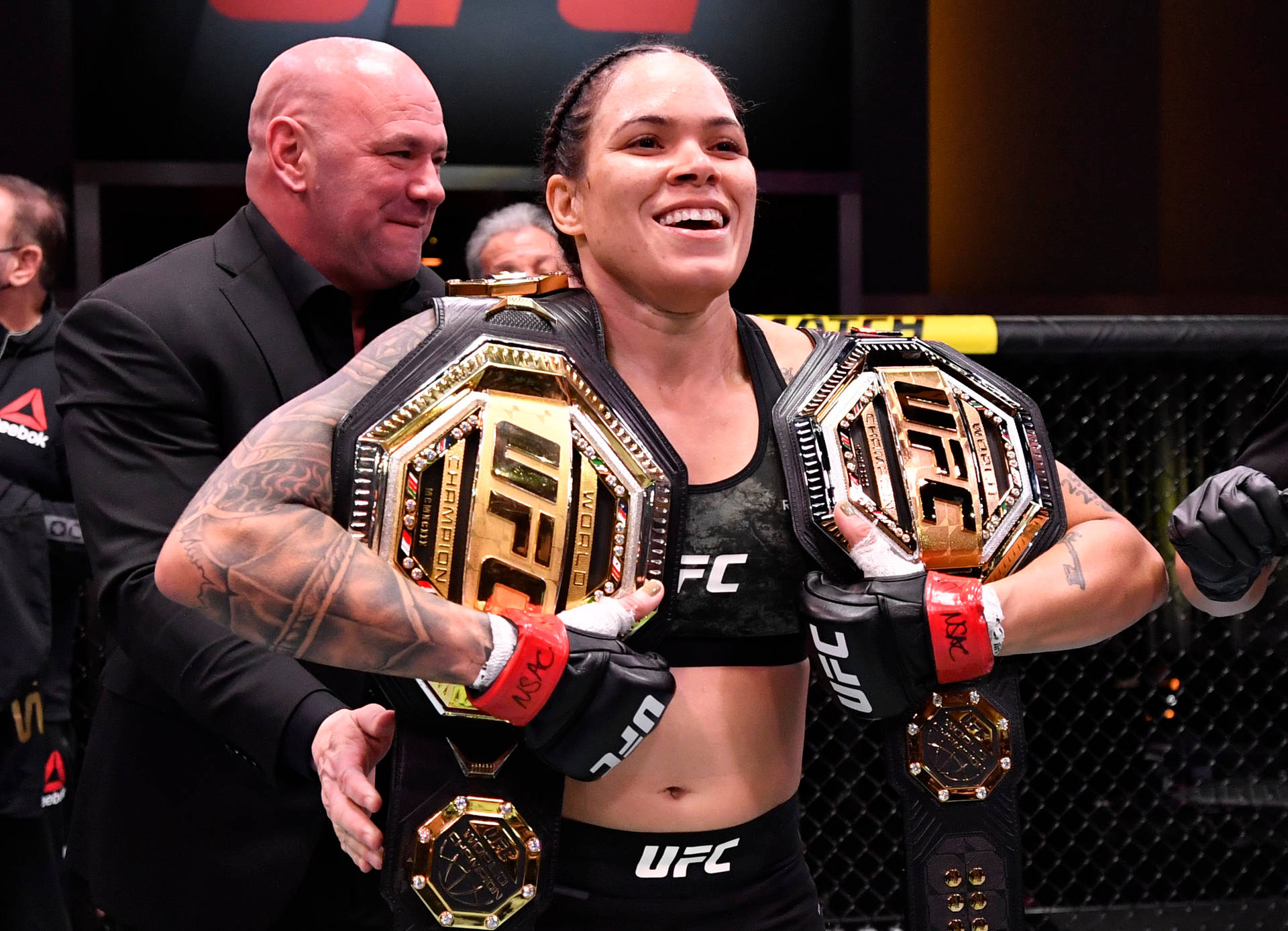 Amanda Nunes Two Championship Belts Background