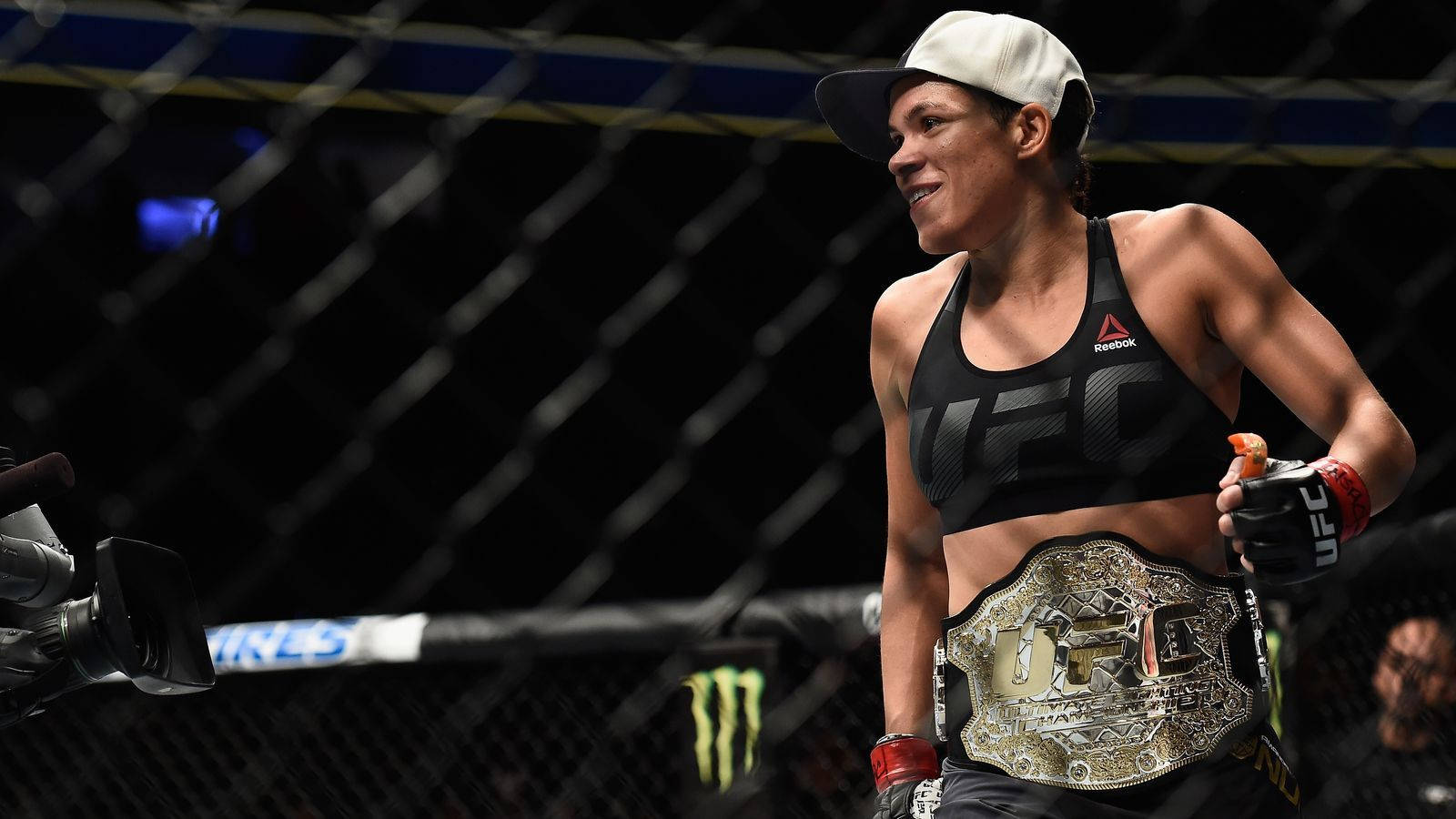 Amanda Nunes With Belt Background