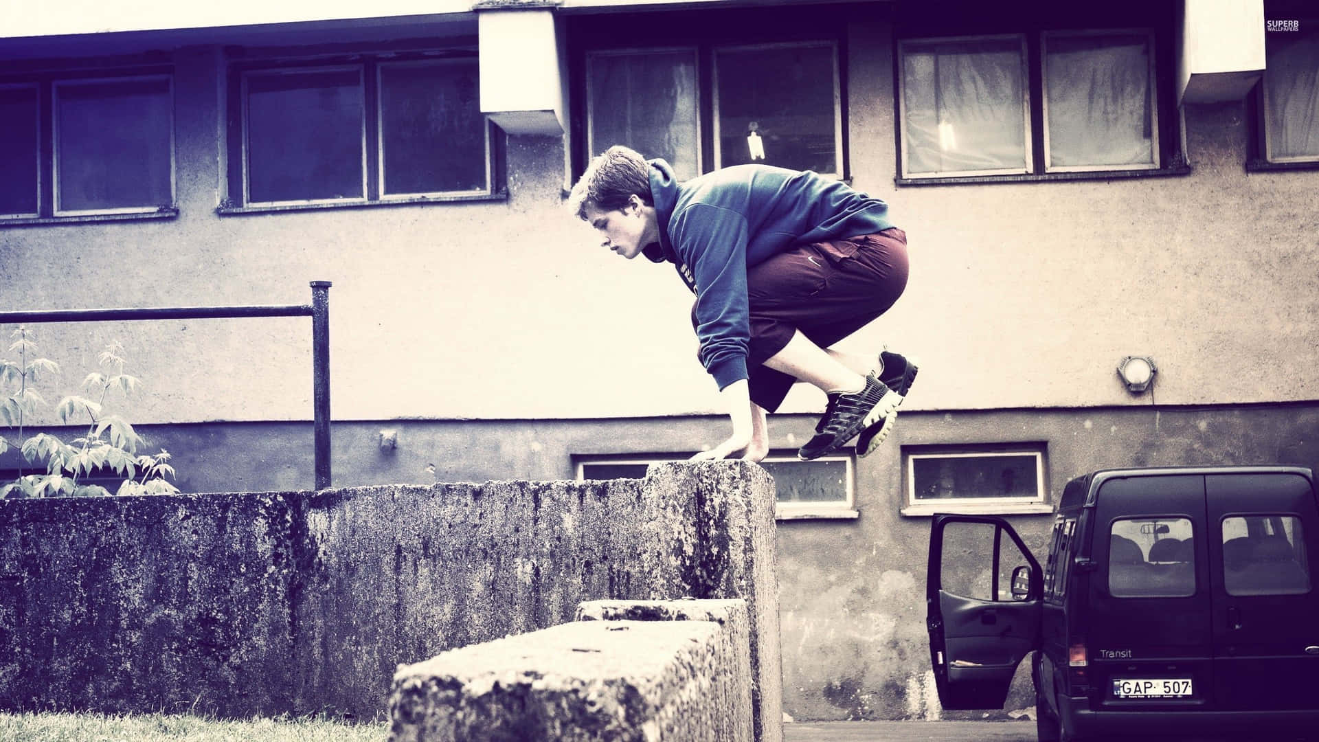 Amateur Traceur Doing Parkour Background