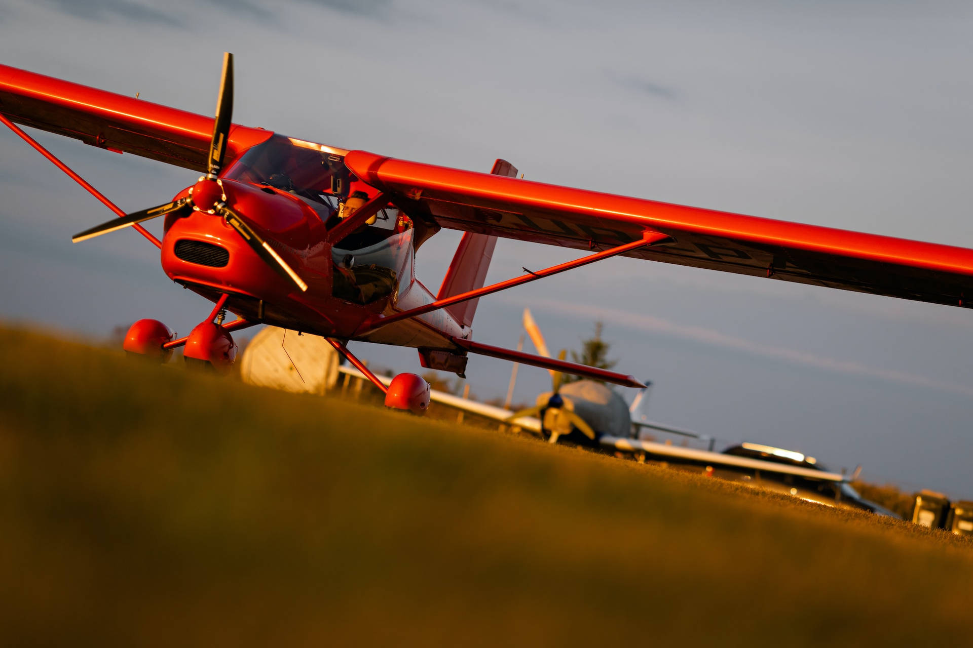 Amazing Red Bi-plane Model Soaring In The Sky