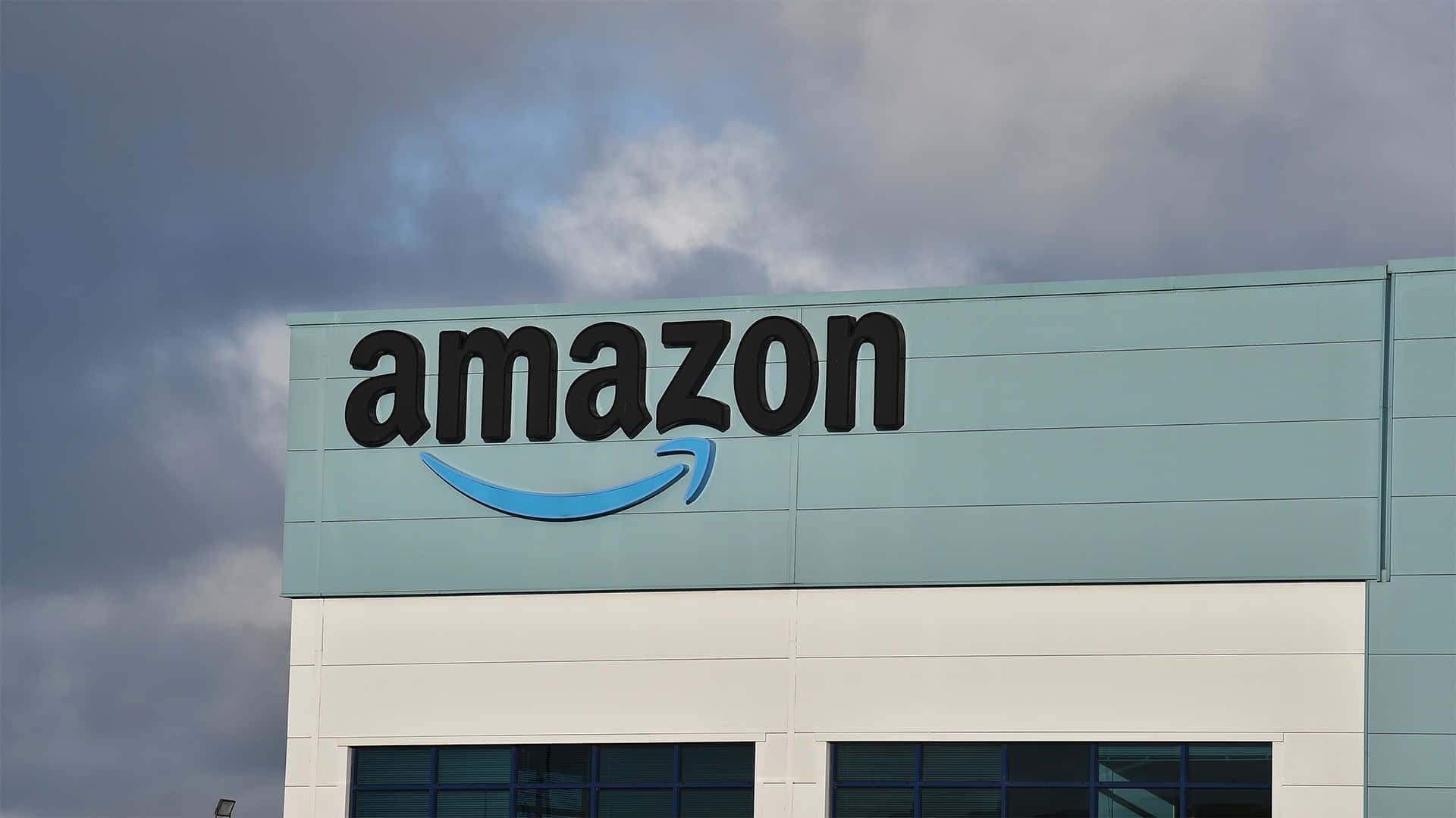 Amazon Uk Logo On Light Teal Building