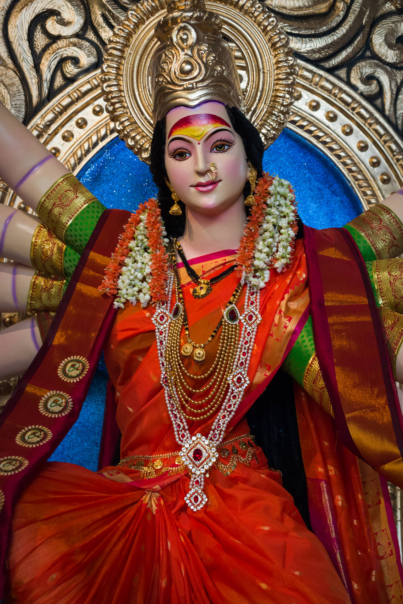 Ambe Maa In Red And Gold Sari Background