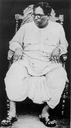 Ambedkar Seated On A Chair Background