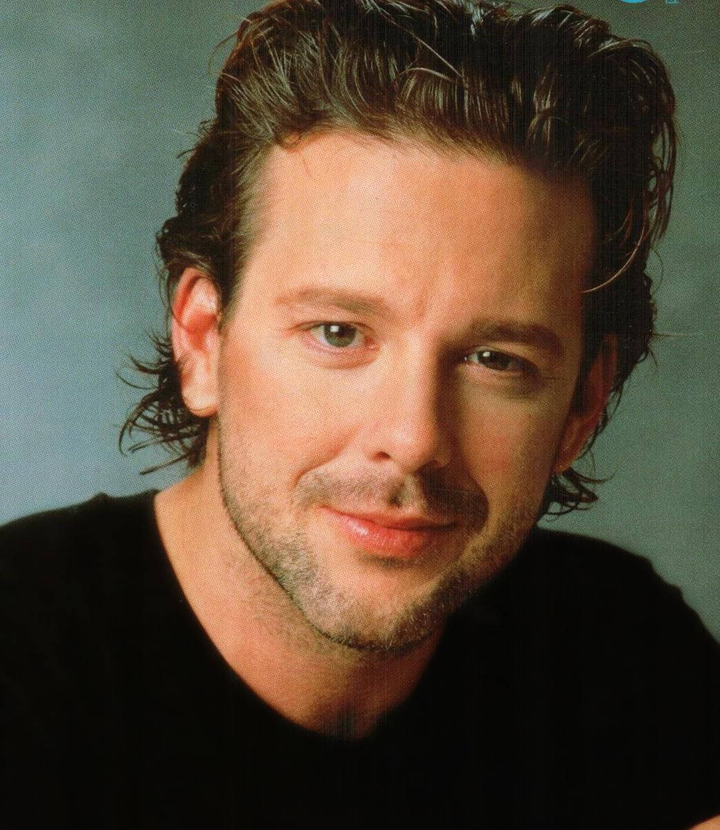 American Actor Mickey Rourke With Pompadour Hairstyle Background