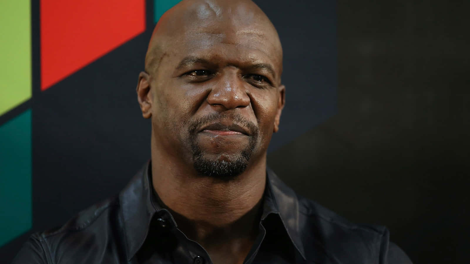 American Actor, Terry Crews, Flexing Muscles And Smiling At The Camera Background