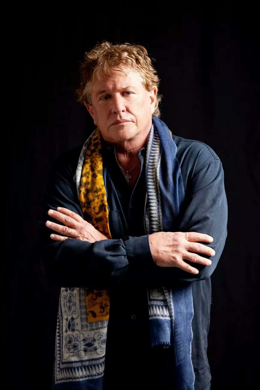 American Actor Tom Berenger In A Classic Pose Background