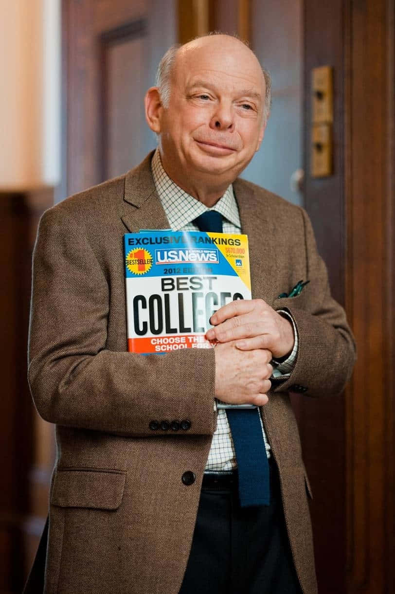 American Actor Wallace Shawn Posing For A Photoshoot. Background