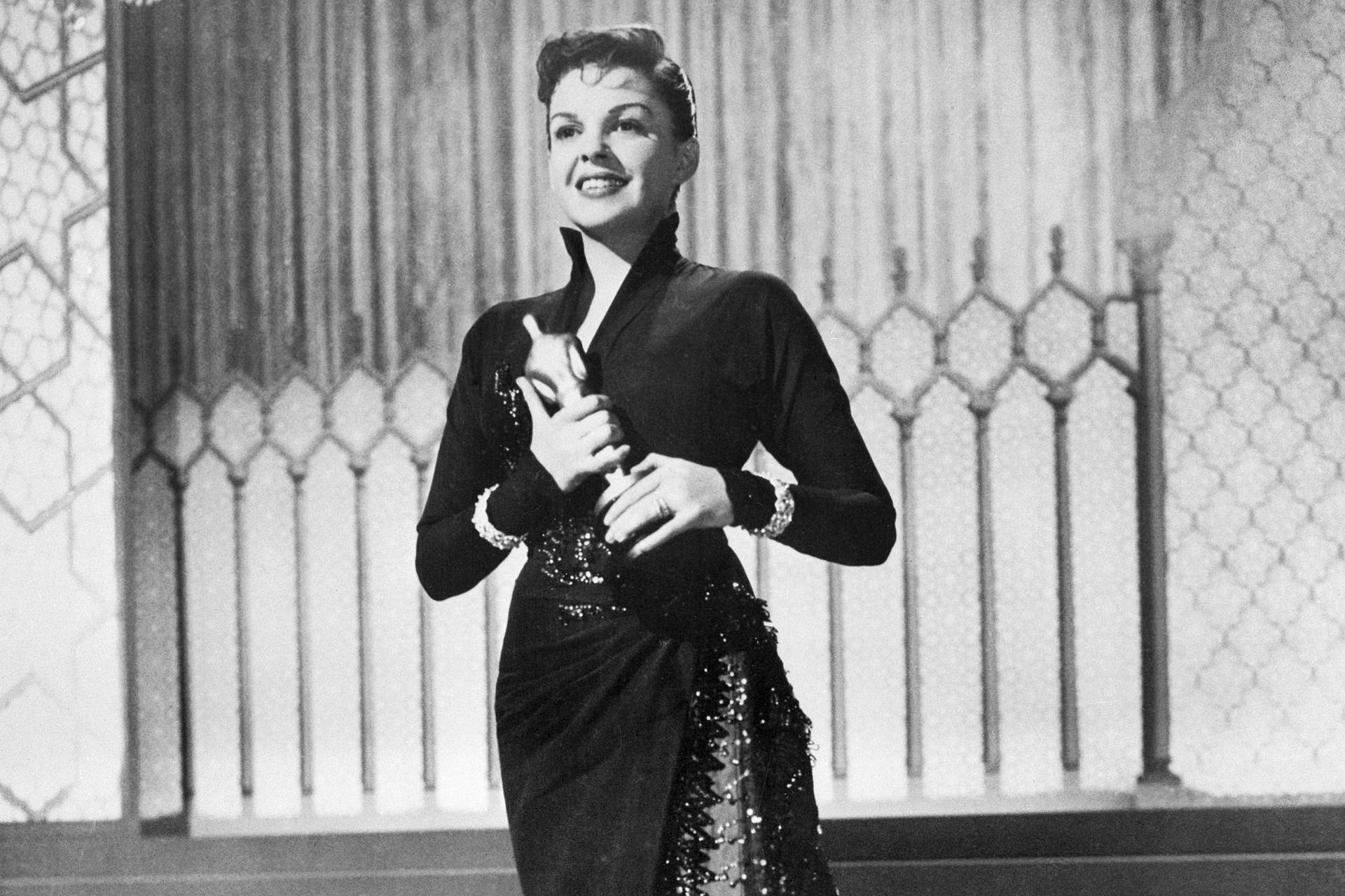 American Actress Judy Garland Oscar Trophy Background