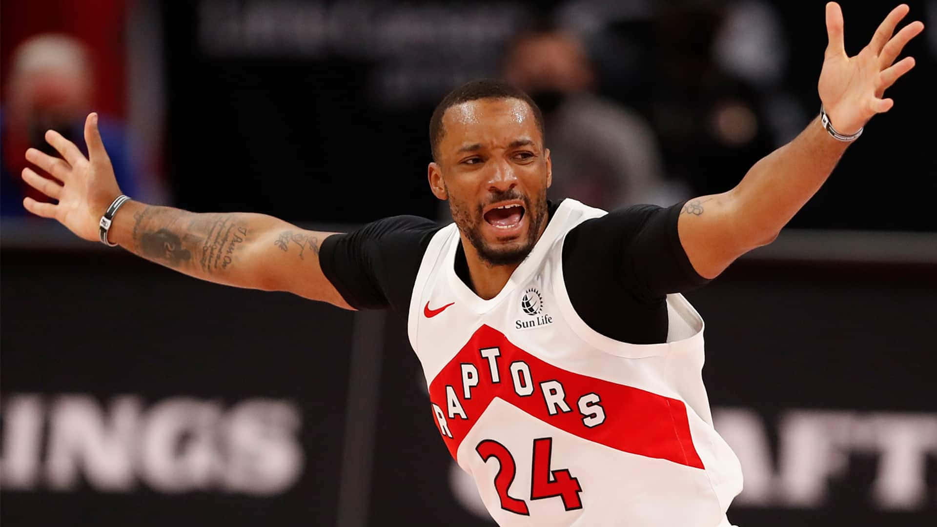 American Basketball Player Norman Powell In Raptors Uniform Background