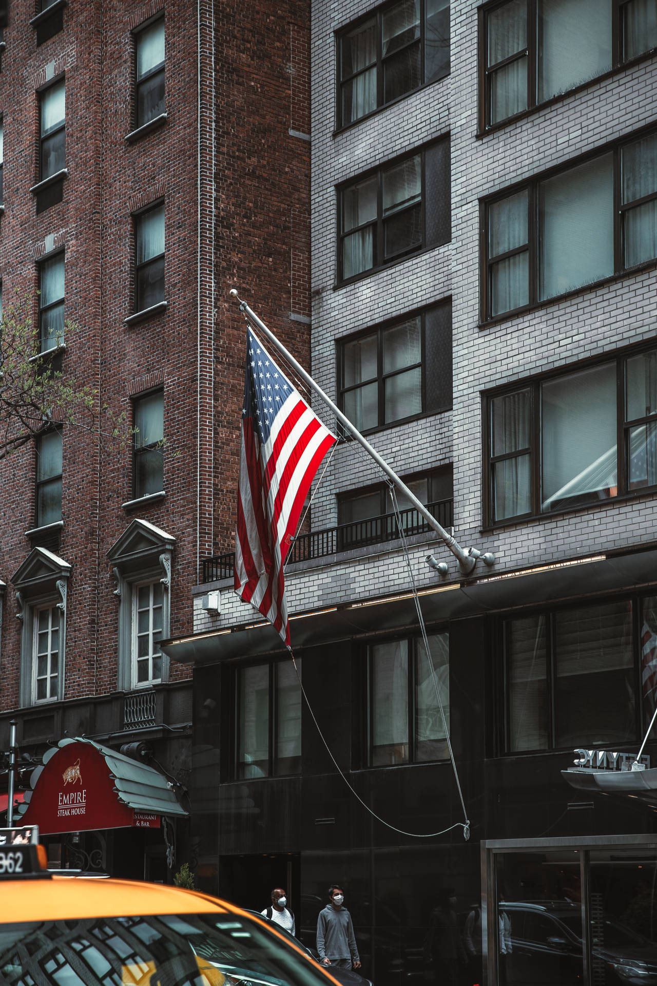 American Flag Iphone Hanging From Building Background