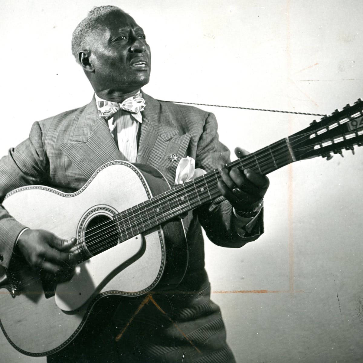 American Folk Blues Singer Leadbelly Black And White Portrait Background