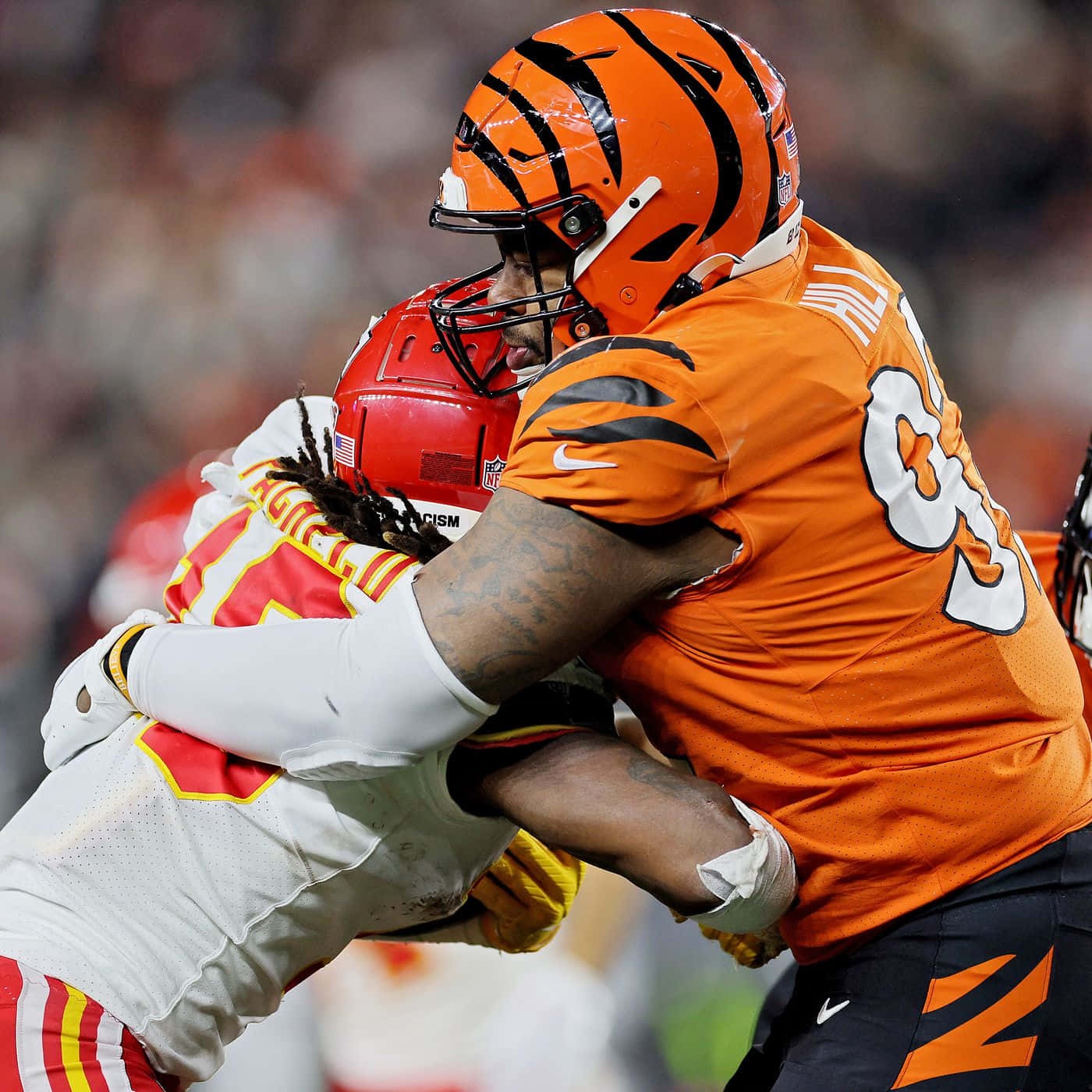 American Football Athlete Bj Hill Tackling Isiah Pacheco Photograph Background