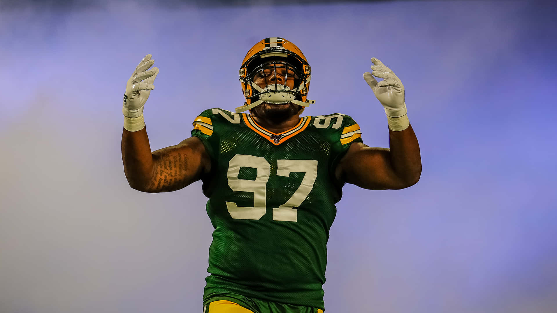 American Football Defensive Tackle Kenny Clark On Smoke Background