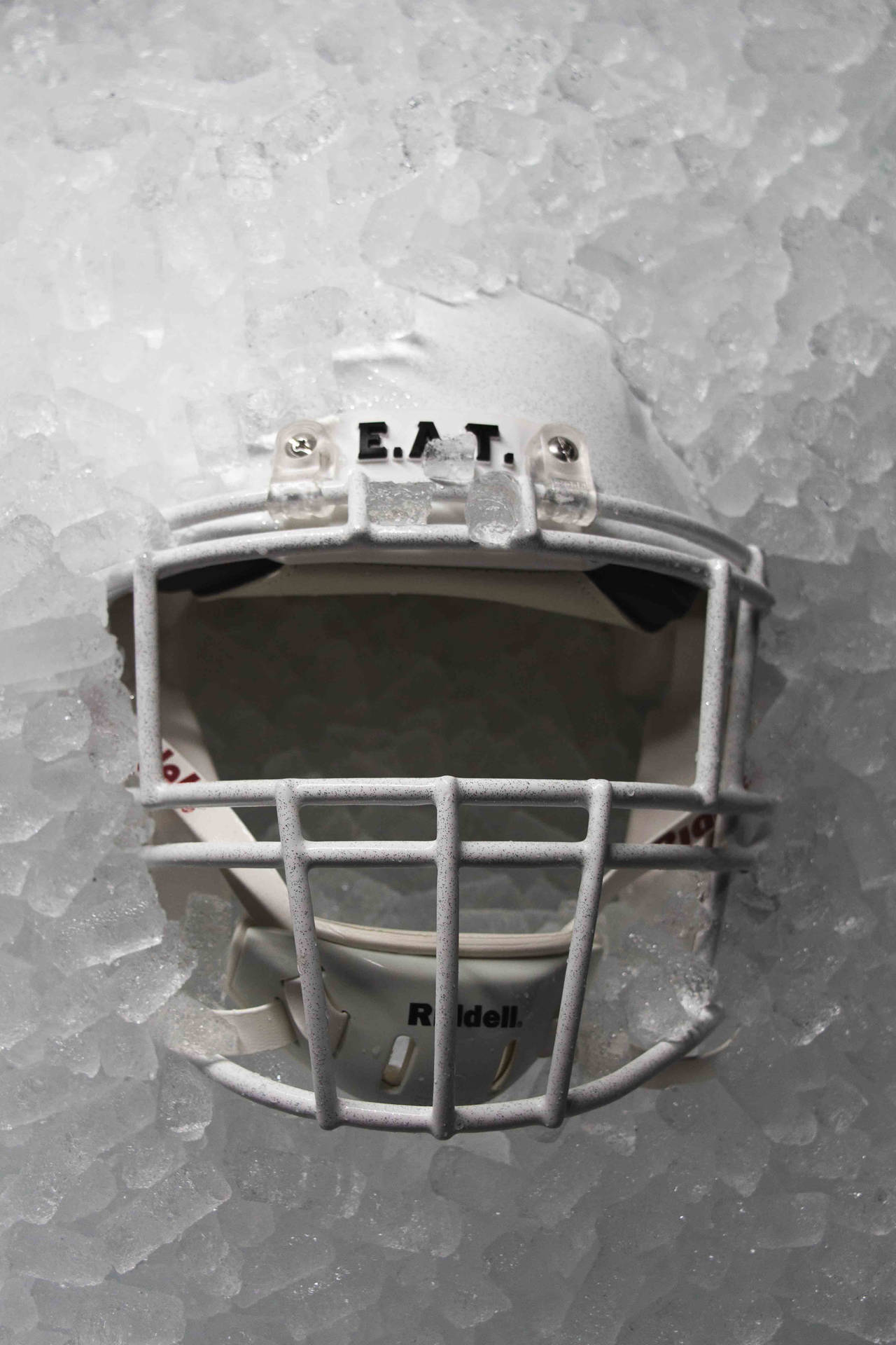 American Football Helmet On Ice Background