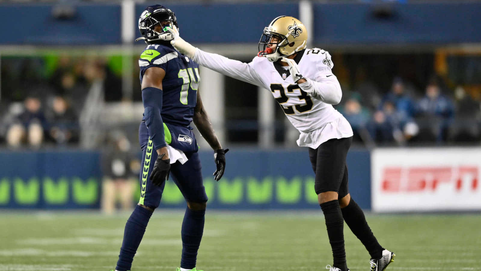 American Football Player Marshon Lattimore Hitting Opponent Background