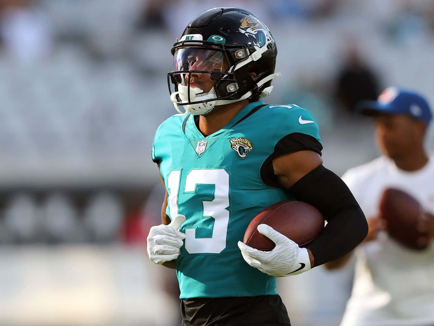 American Footballer Christian Kirk Blue Green Background